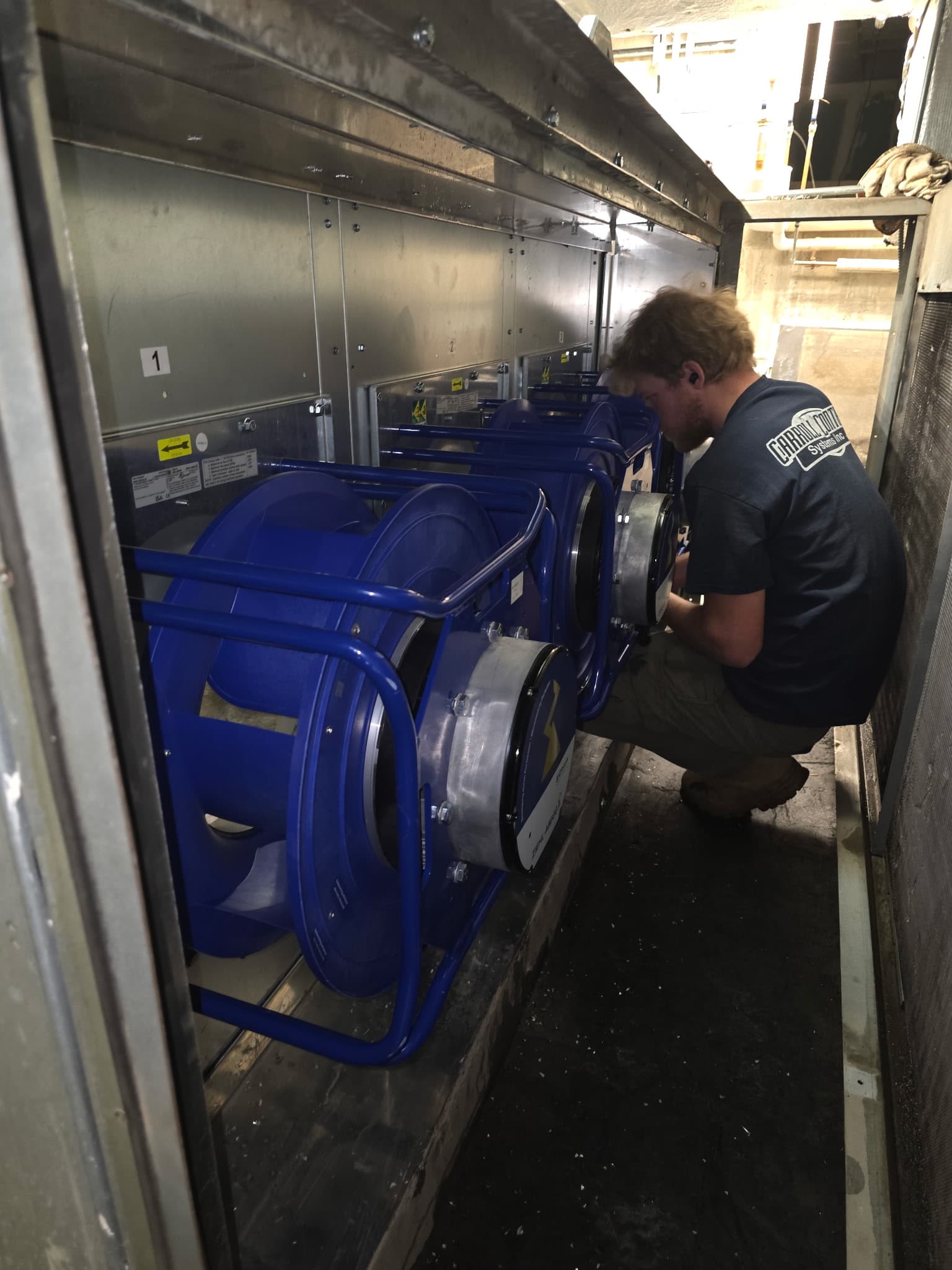 Technician working on air handling unit